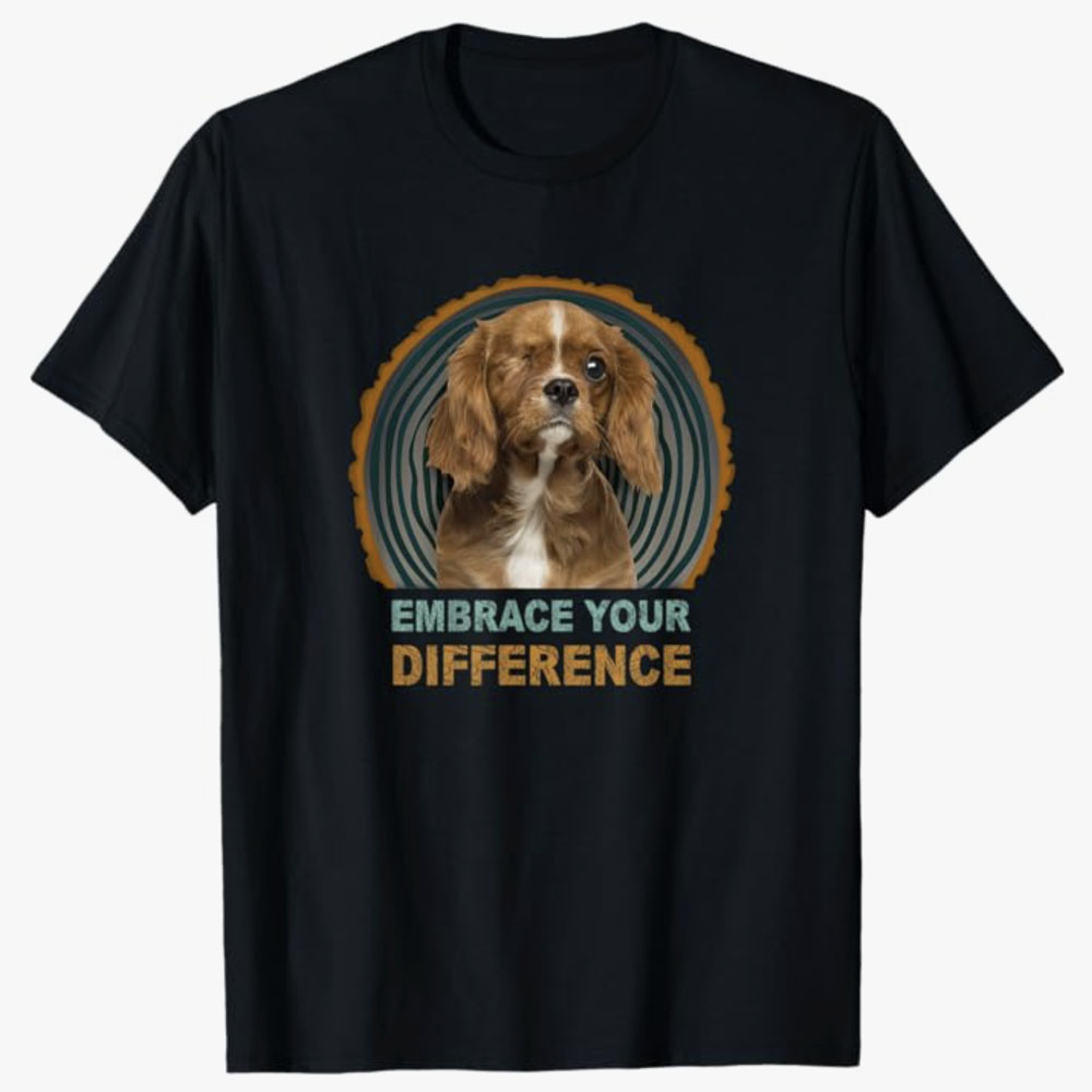 Black T-shirt featuring a one-eyed dog with the text Embrace Your Difference, spreading a message of acceptance, self-love, and celebrating uniqueness through an uplifting design.