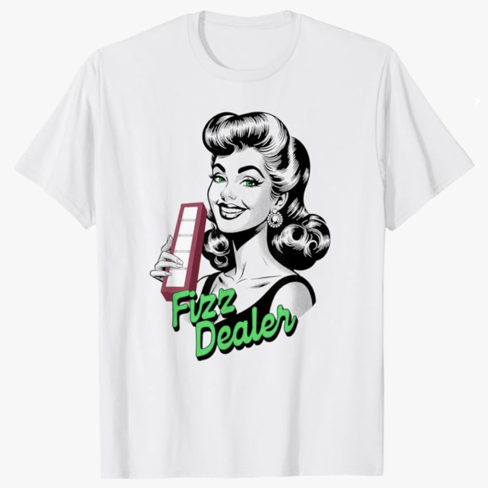 A white T-shirt features a retro-style woman holding a rectangular fizz bar, paired with the playful phrase Fizz Dealer in bright green lettering. The design blends vintage charm with modern fizz culture for a fun, eye-catching look.