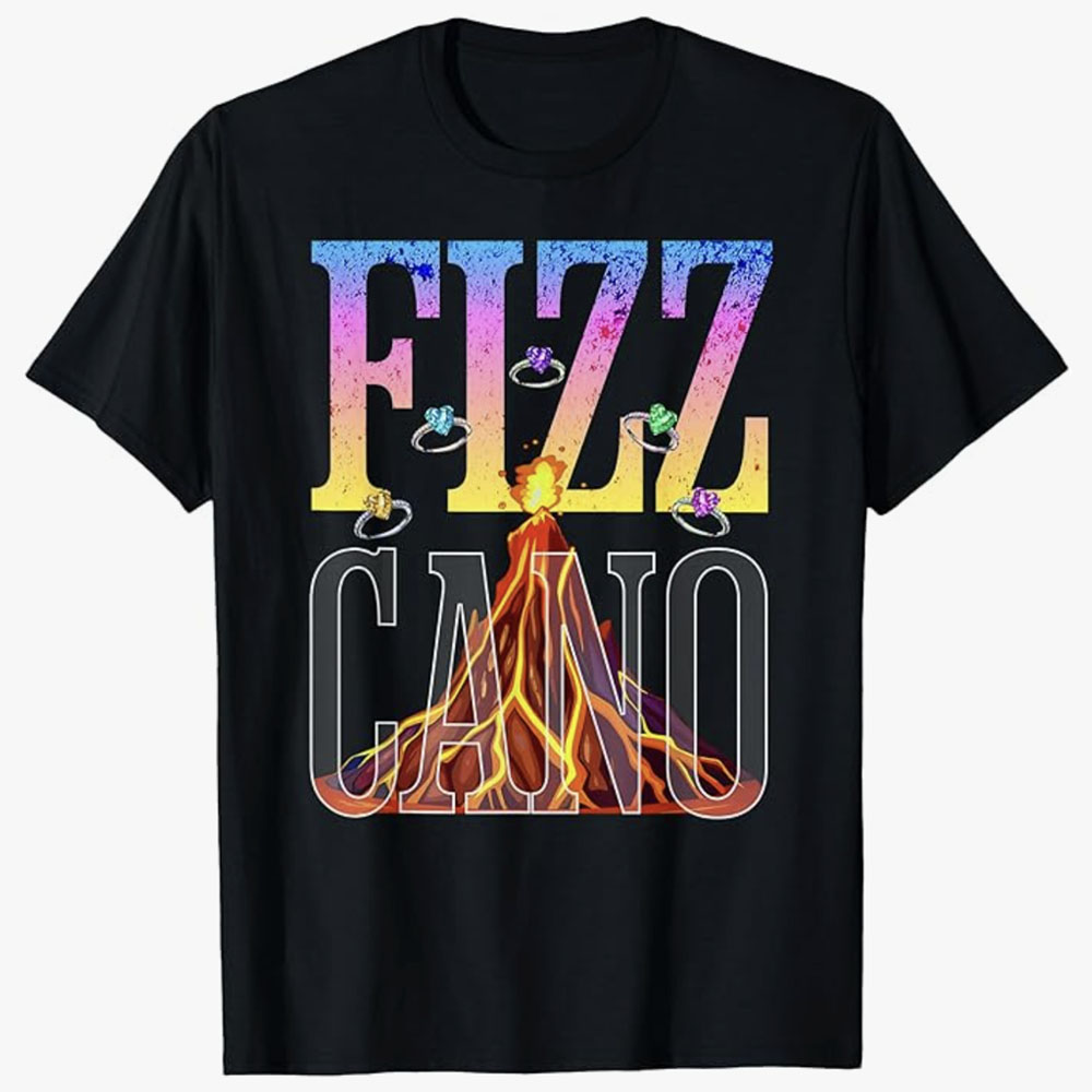 A black T-shirt features the word FIZZ in bold gradient letters above an erupting volcano graphic with sparkling rings shooting out, forming the playful phrase Fizzcano. The design blends volcanic energy with fizzy, colorful excitement for a fun visual effect.