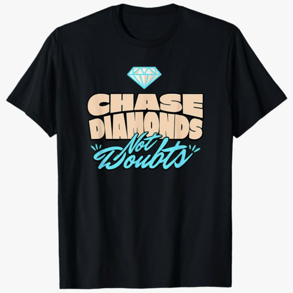 A black T-shirt displays the motivational phrase Chase Diamonds Not Doubts with a small diamond icon above the text. The design encourages confidence, ambition, and focusing on goals with a positive mindset.