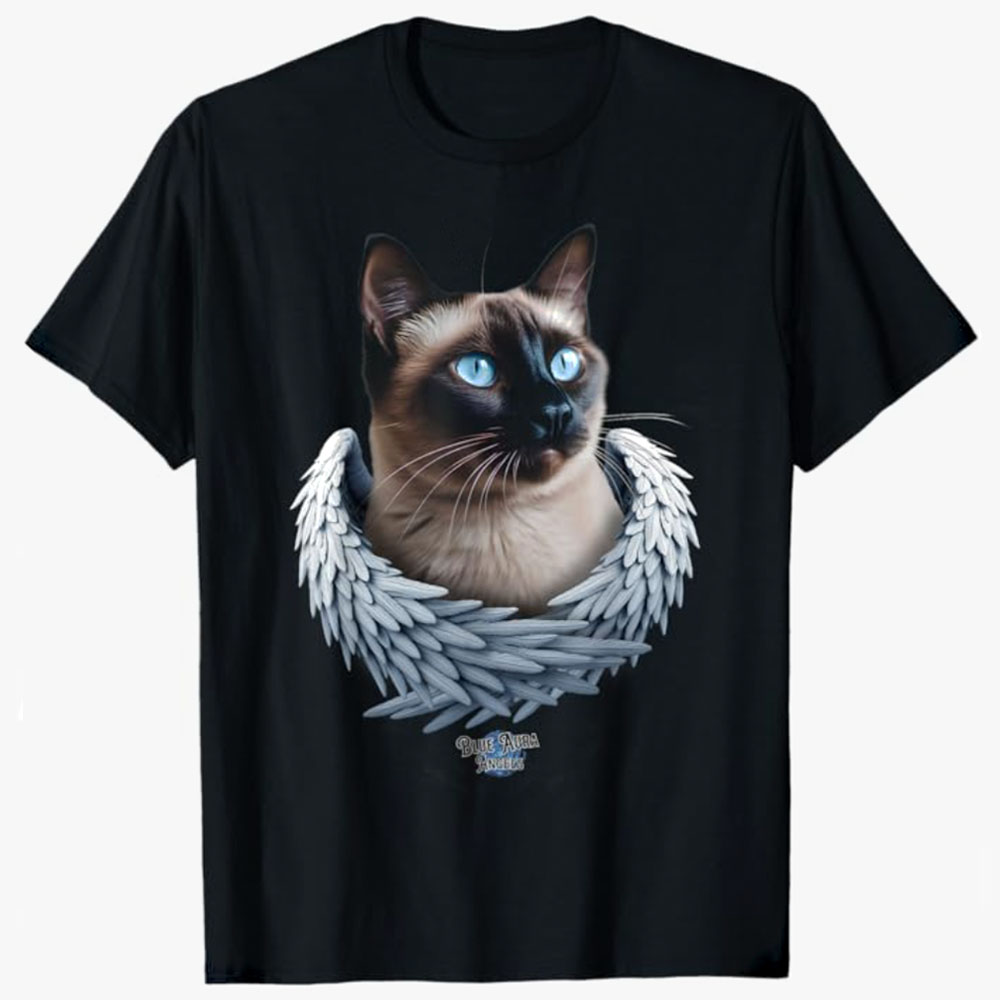 A black T-shirt features a Siamese cat with bright blue eyes framed by angel wings, creating a touching design that symbolizes love, memory, and companionship.