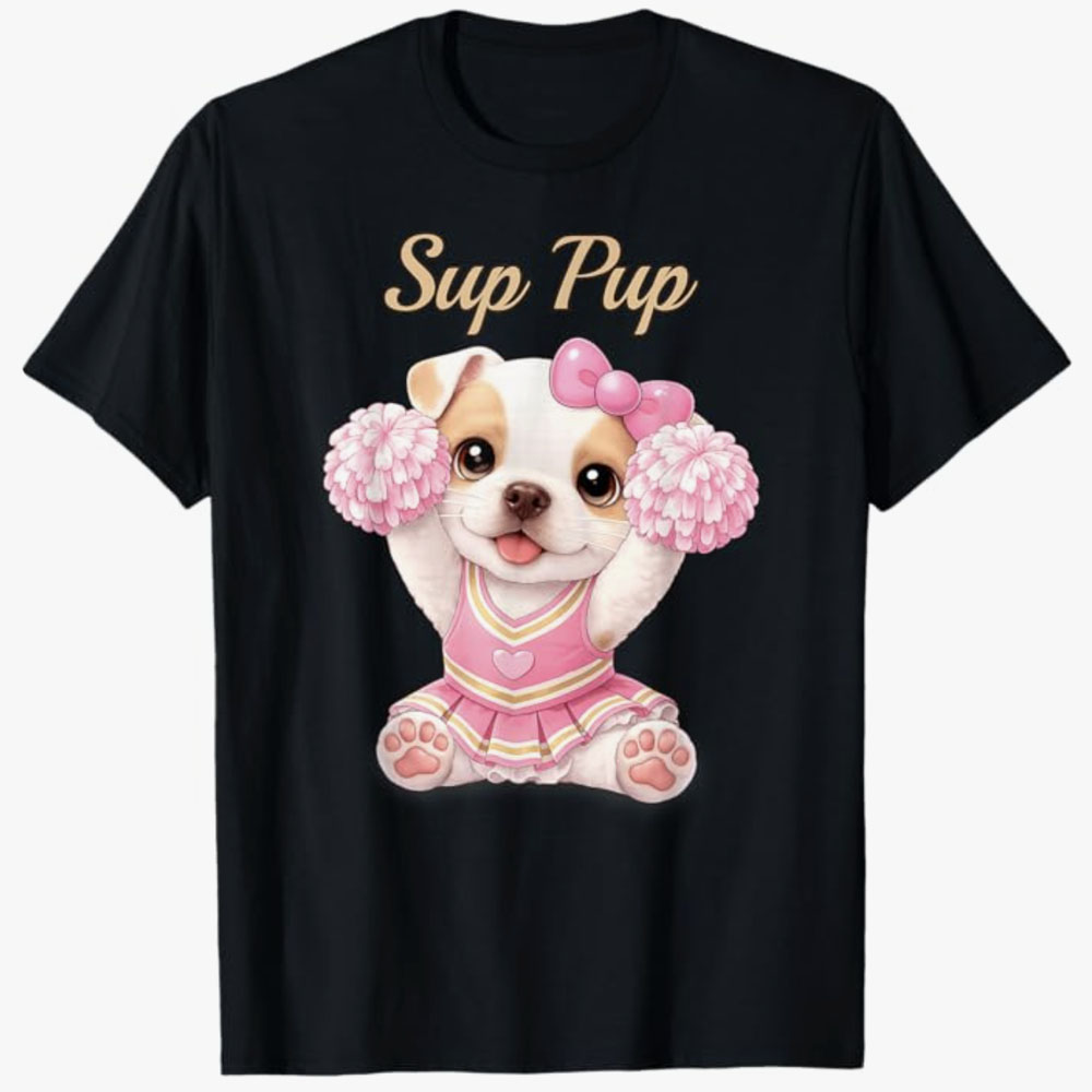 A black T-shirt features a cute puppy with a pink bow dressed as a cheerleader holding pom-poms with the phrase Sup Pup, creating a fun and playful cheer-themed puppy design.