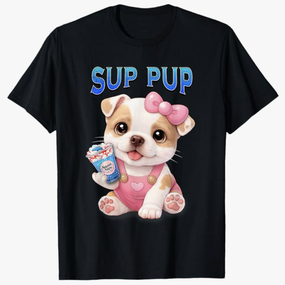 A black T-shirt features a cute cartoon puppy with a pink bow holding a colorful drink under the phrase Sup Pup, creating a fun and playful design for dog lovers.
