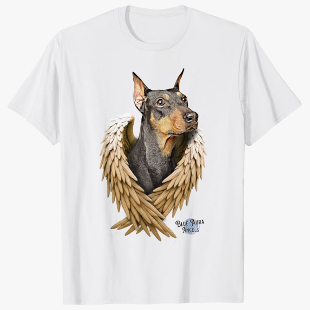 A white T-shirt features a Doberman with angel wings, symbolizing a heartfelt memorial tribute to a beloved pet.